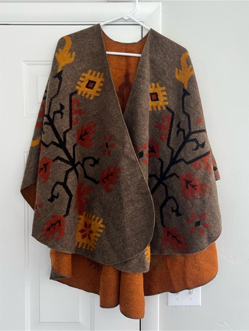 Brown, rust, and mustard patterned poncho/ Cape with Orange Lining